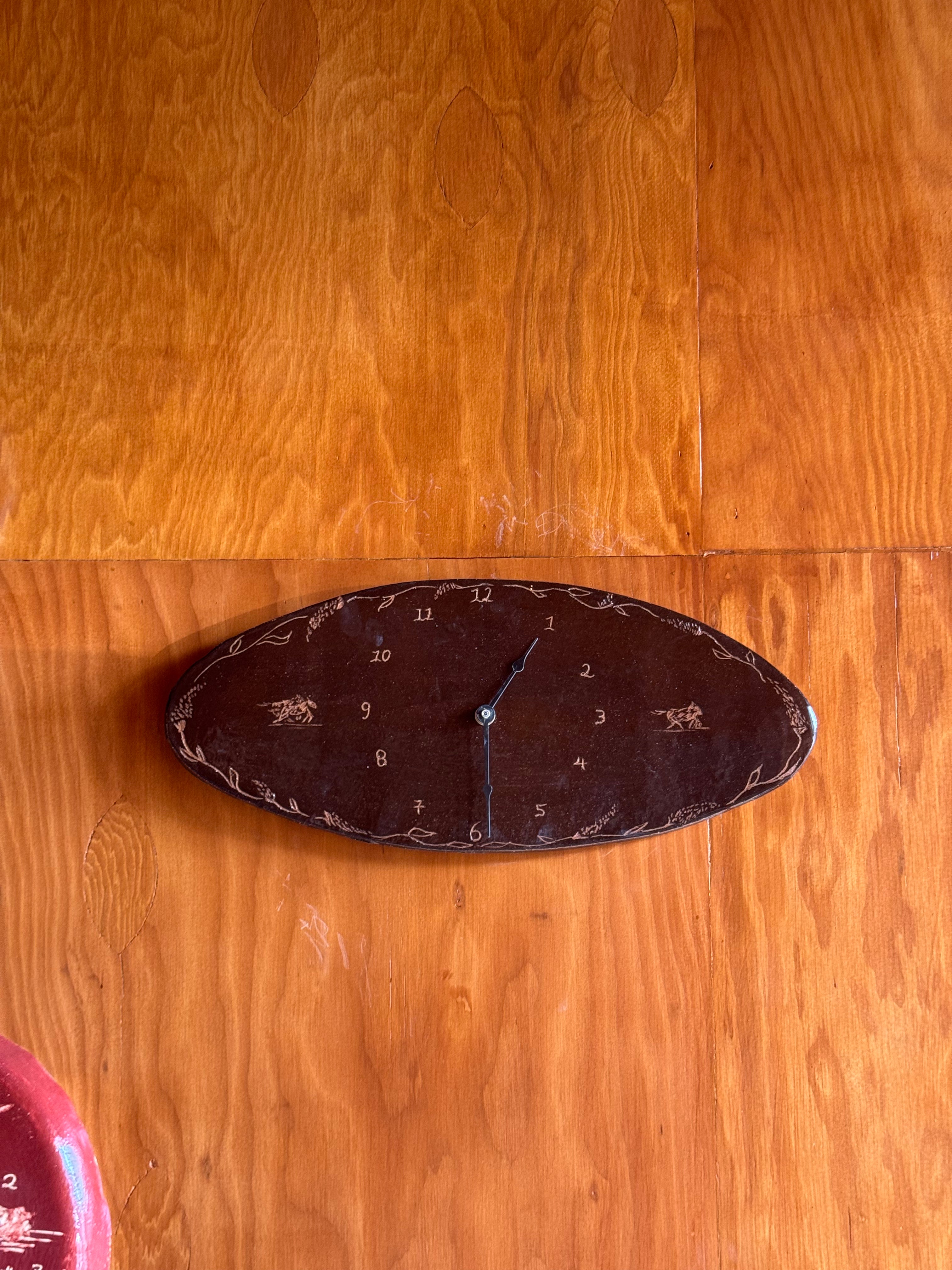 Solo Ride Oval Clock