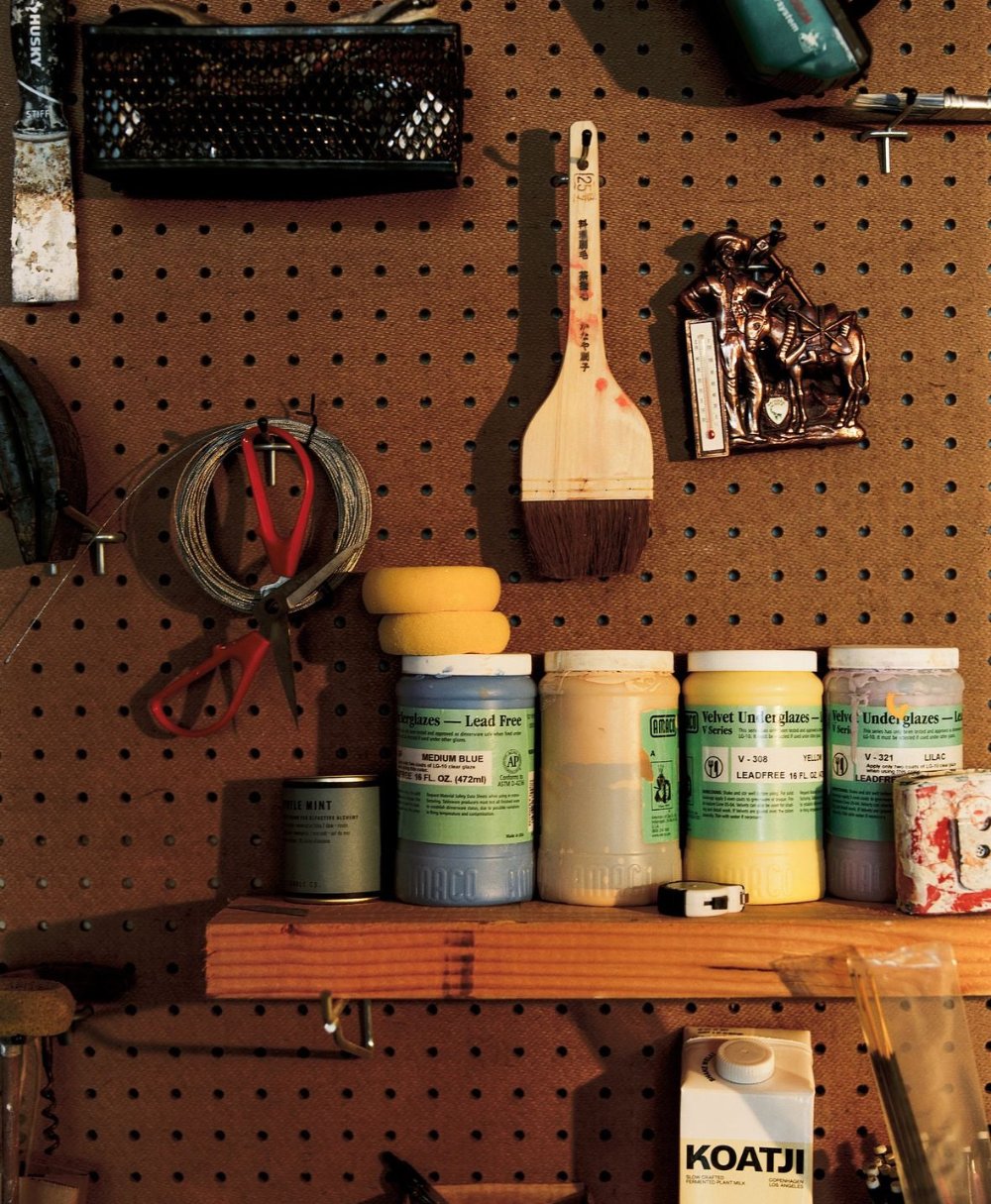 tools on the mud shop wall